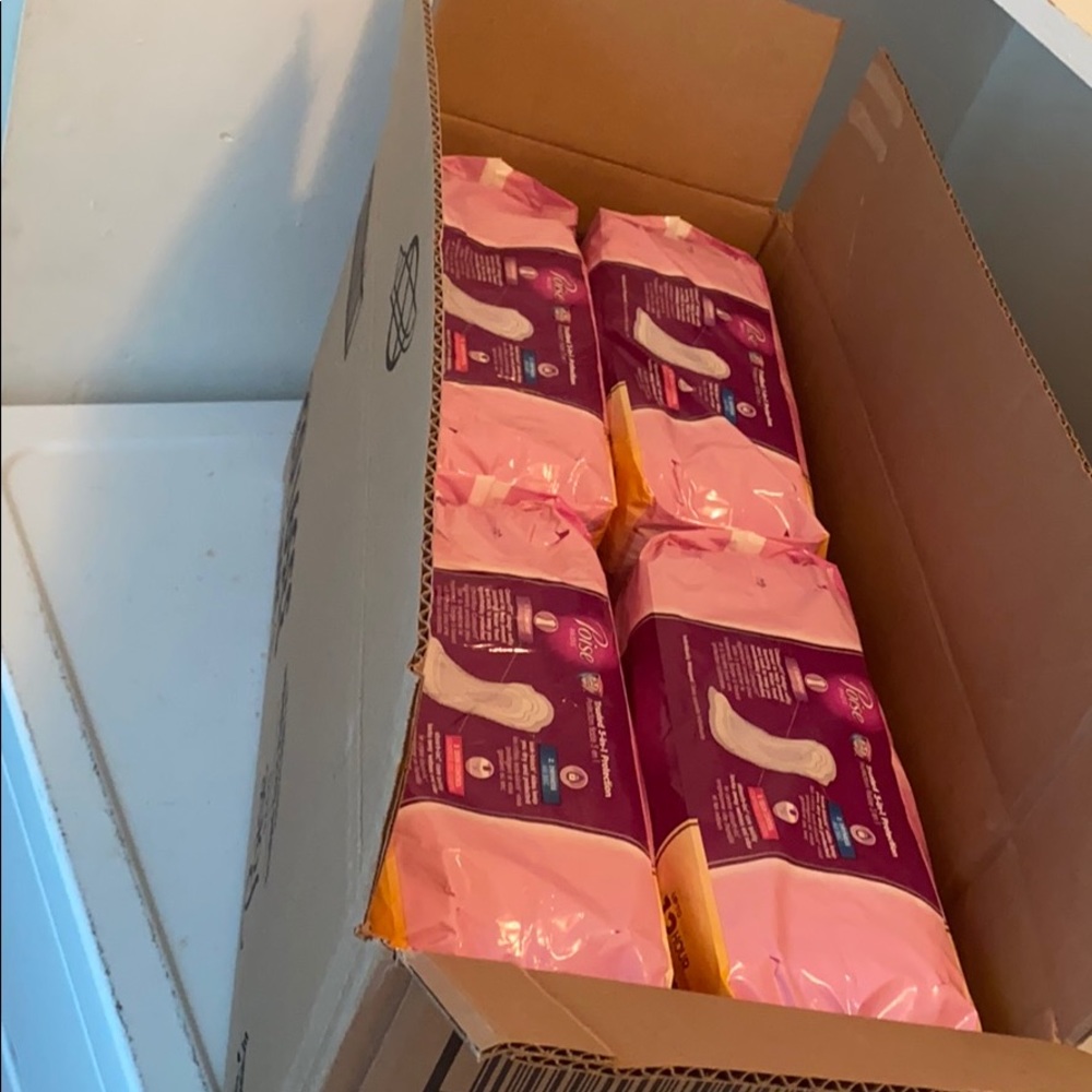 4 packs of Poise Pads long length maximum strength